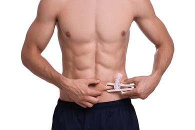 Photo of Man measuring body fat with caliper on white background, closeup