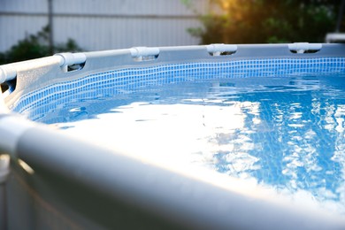 Photo of Above ground swimming pool outdoors on sunny day, closeup