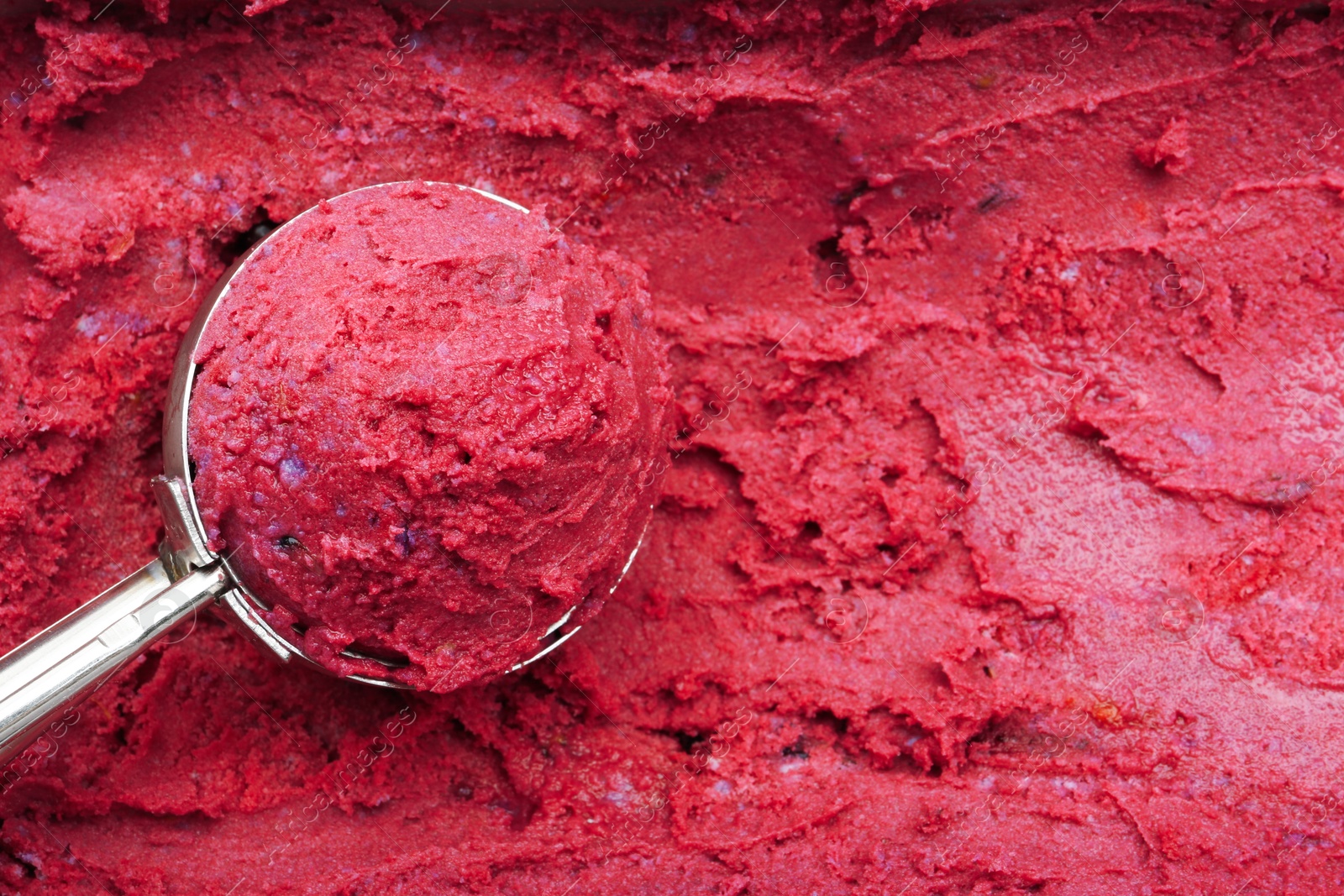 Photo of Scoop of tasty berry sorbet, closeup. Space for text