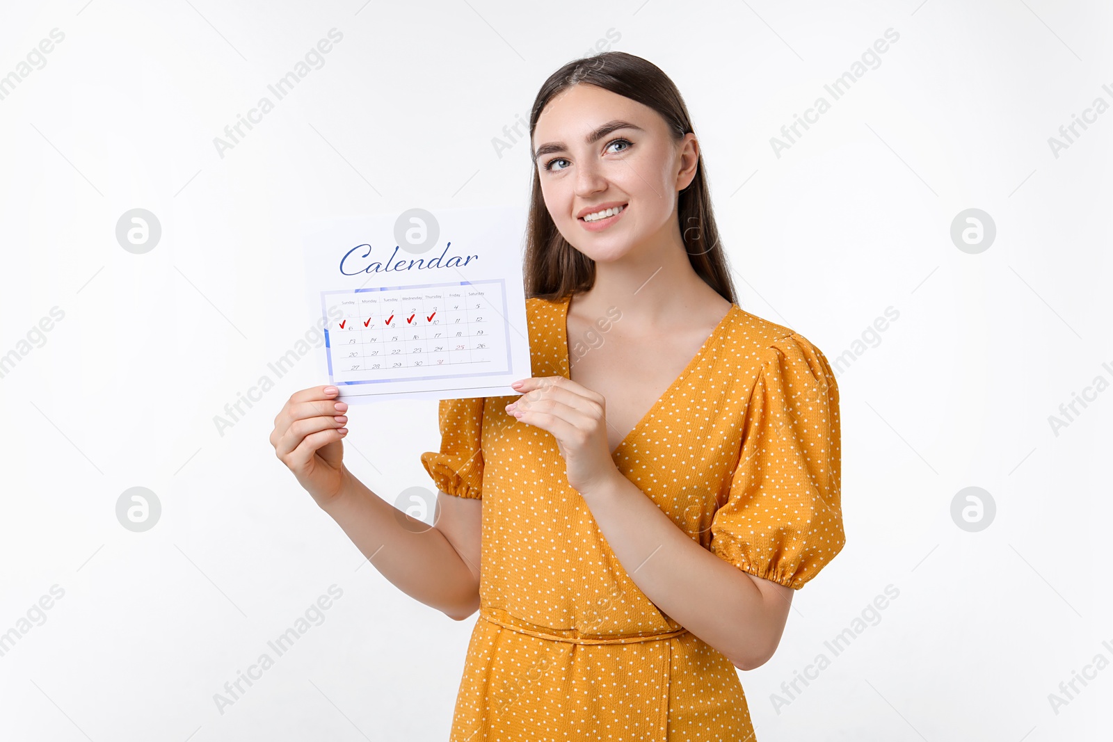 Photo of Woman holding calendar with marked menstrual cycle days on white background