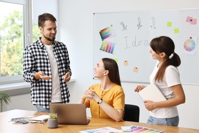 Group of designers working together in office