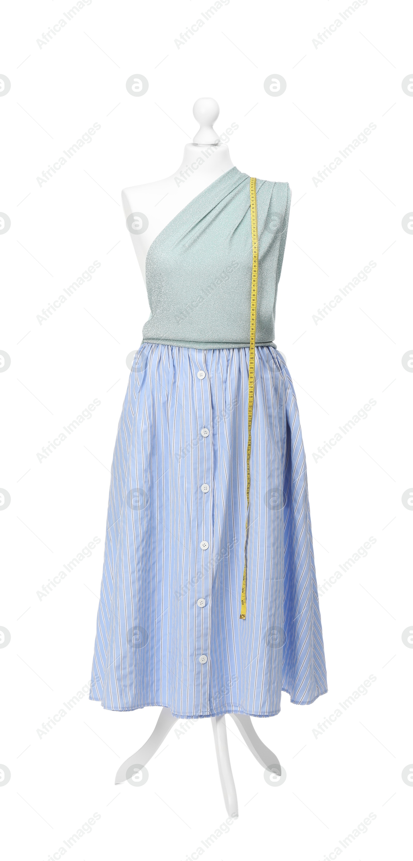 Photo of Mannequin with skirt, shirt and measuring tape isolated on white. Creating new outfit