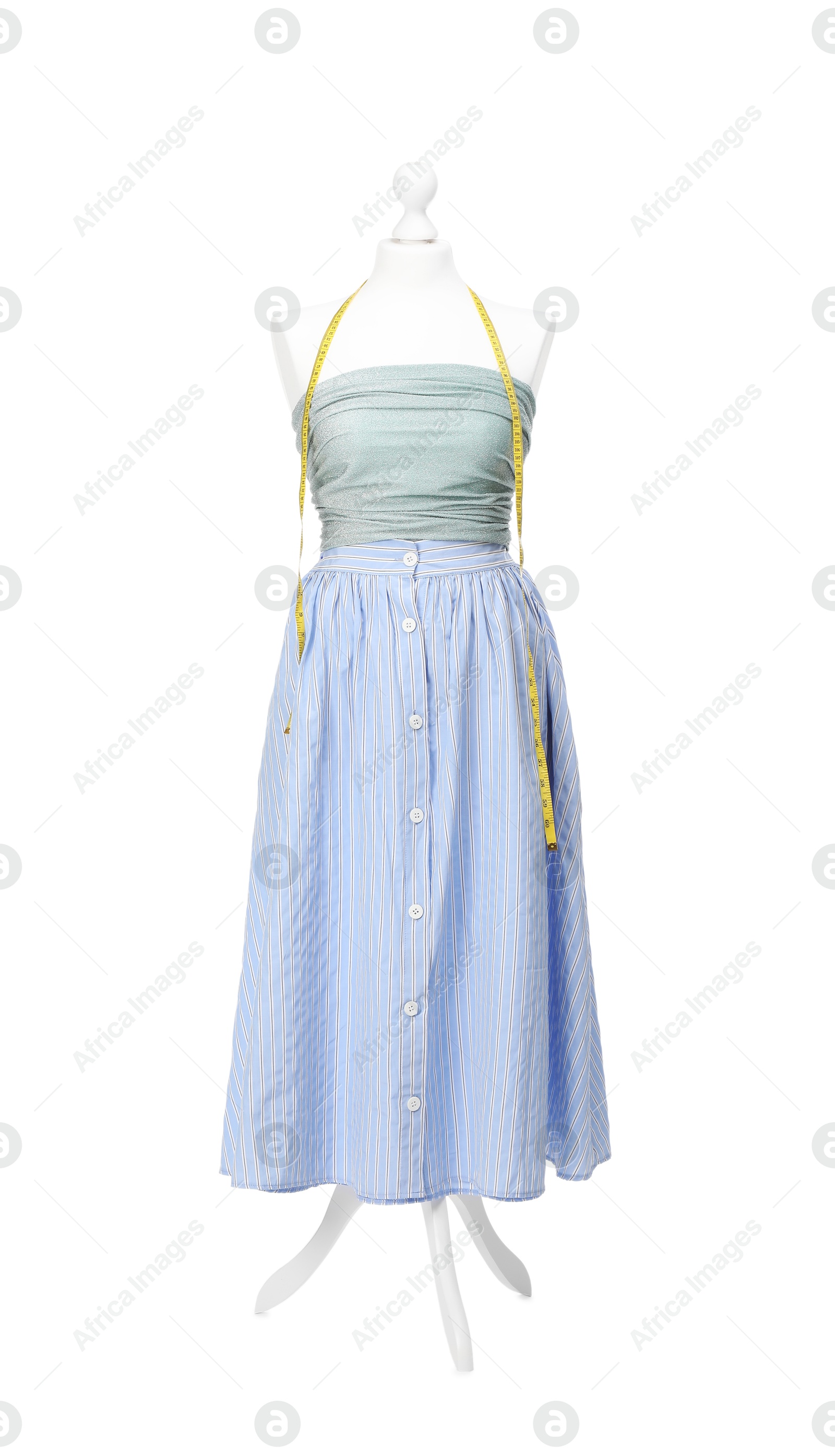 Photo of Mannequin with skirt, shirt and measuring tape isolated on white. Creating new outfit