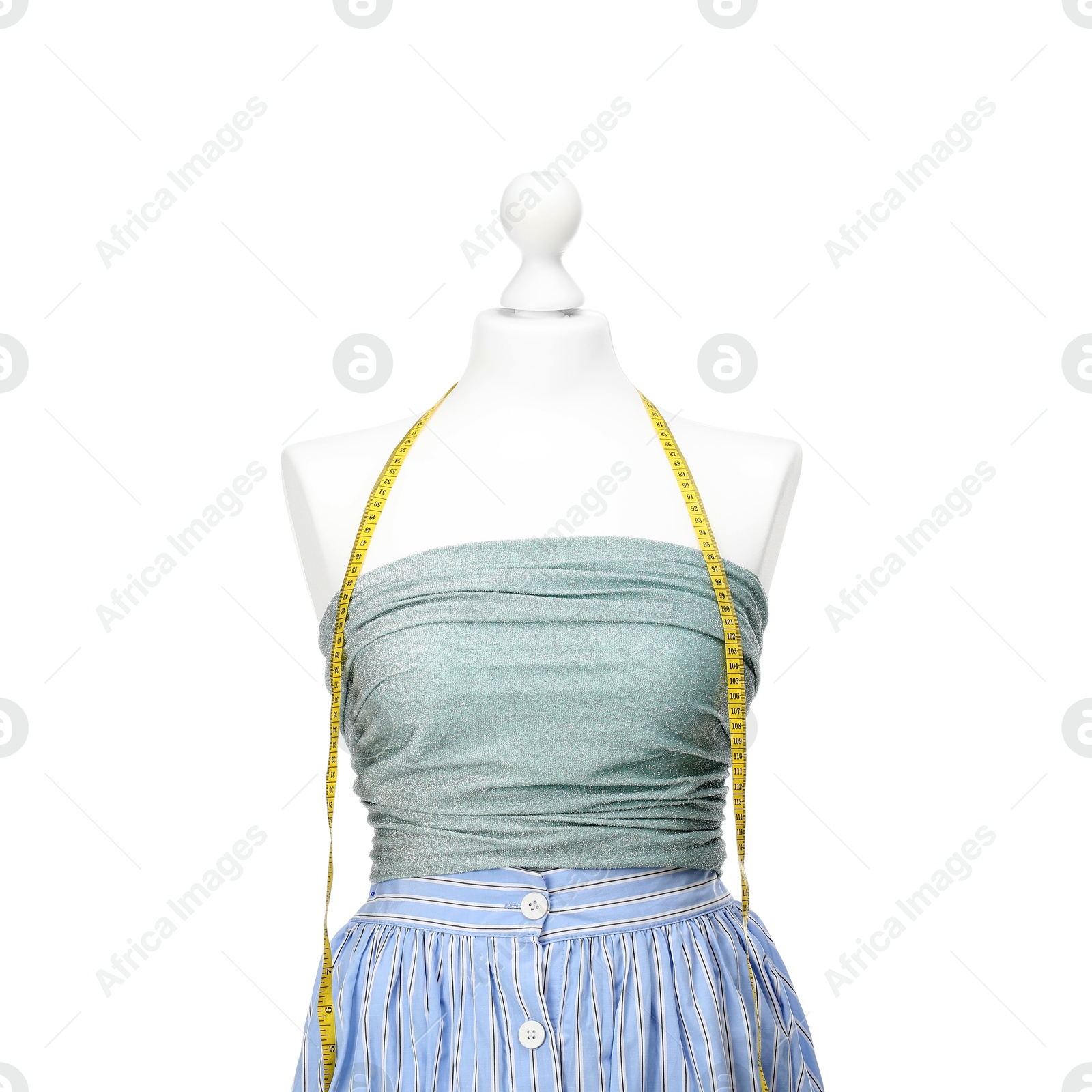 Photo of Mannequin with skirt, shirt and measuring tape isolated on white. Creating new outfit