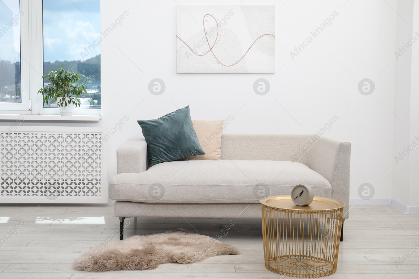 Photo of Comfortable couch in living room. Interior design