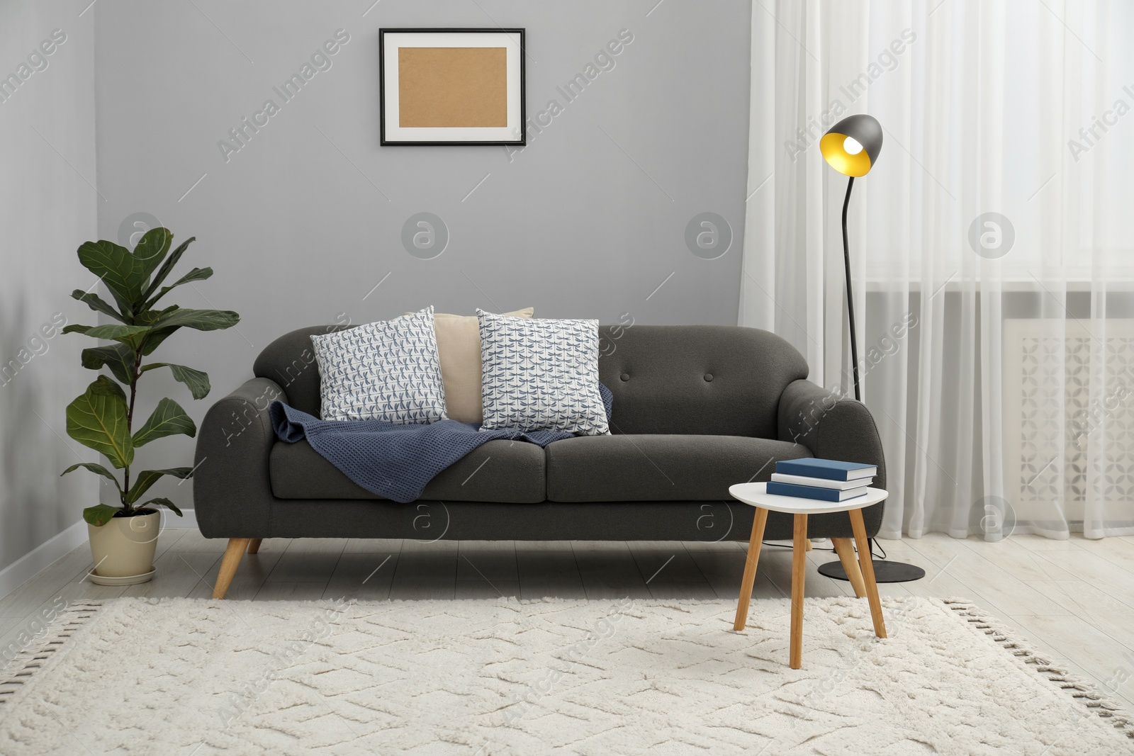 Photo of Comfortable couch in living room. Interior design