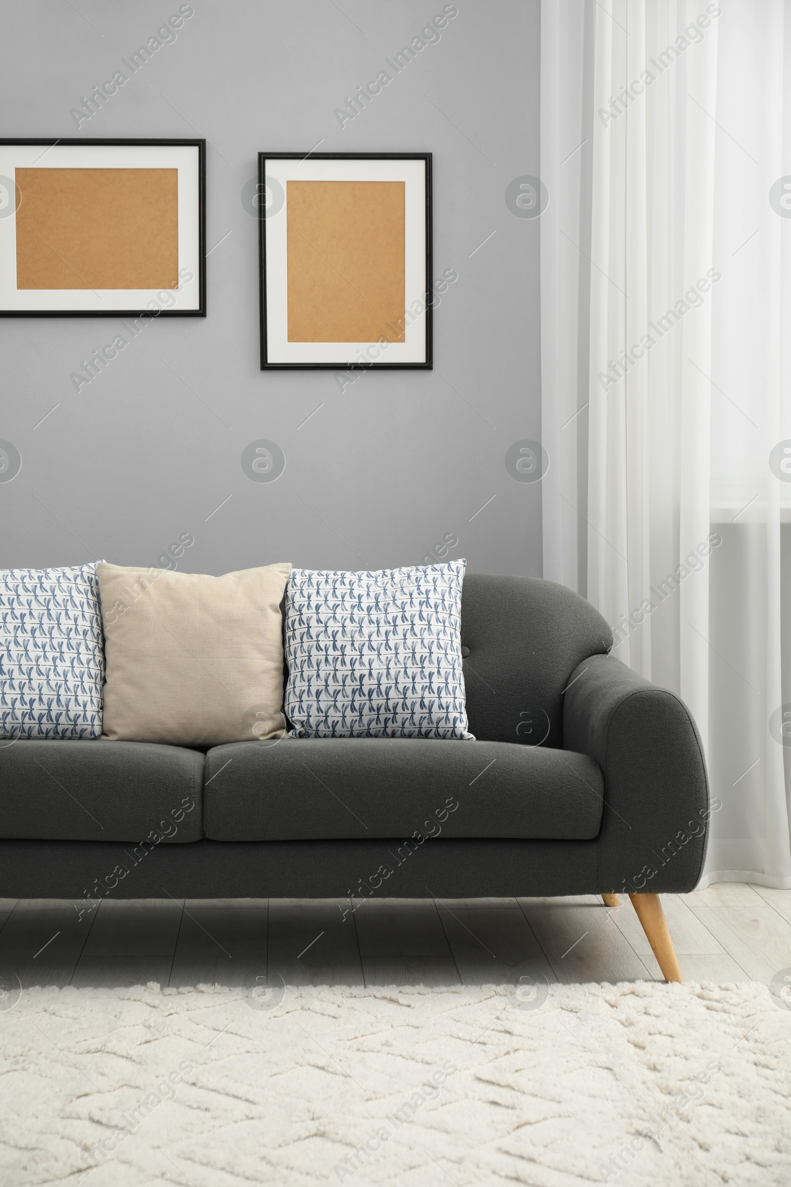 Photo of Comfortable couch in living room. Interior design