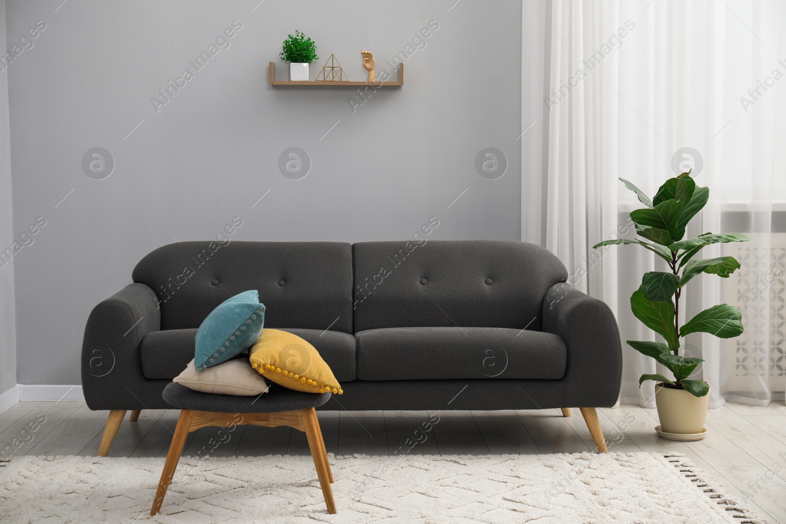 Photo of Comfortable couch in living room. Interior design