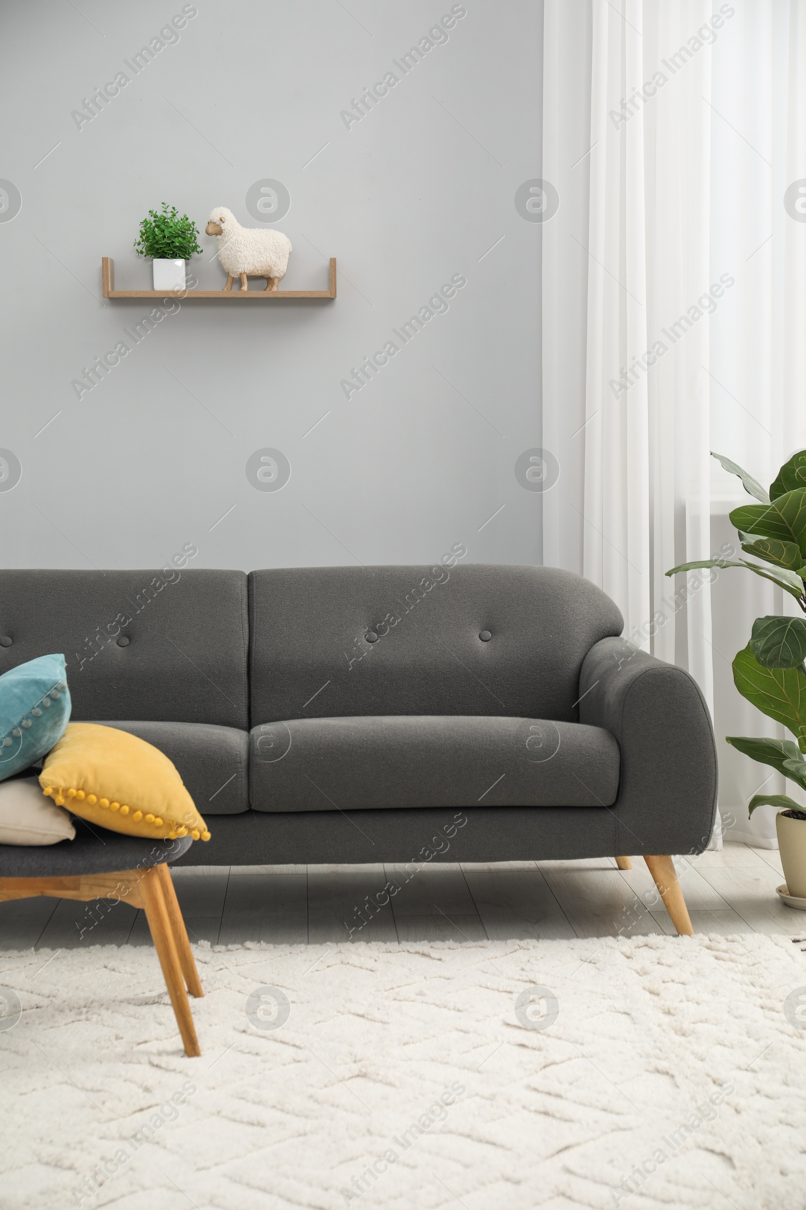 Photo of Comfortable couch in living room. Interior design