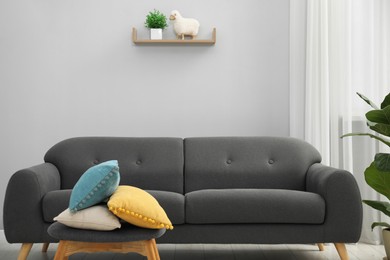 Photo of Comfortable couch in living room. Interior design