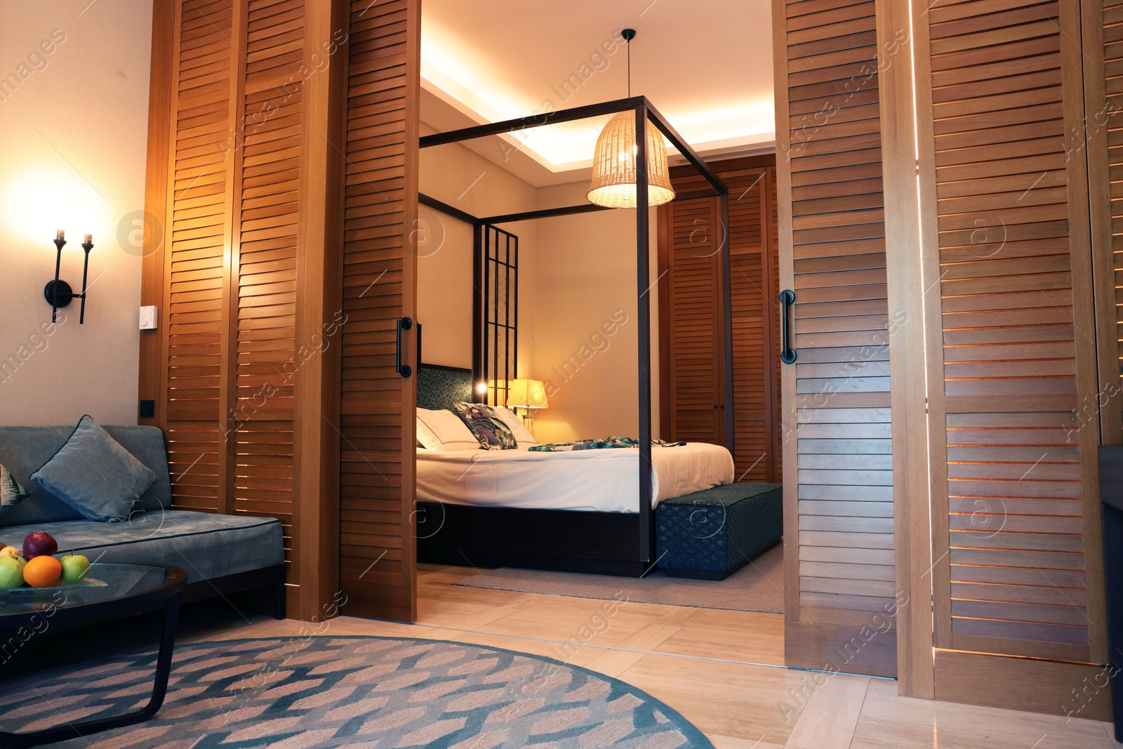 Photo of Stylish wooden sliding doors in hotel room