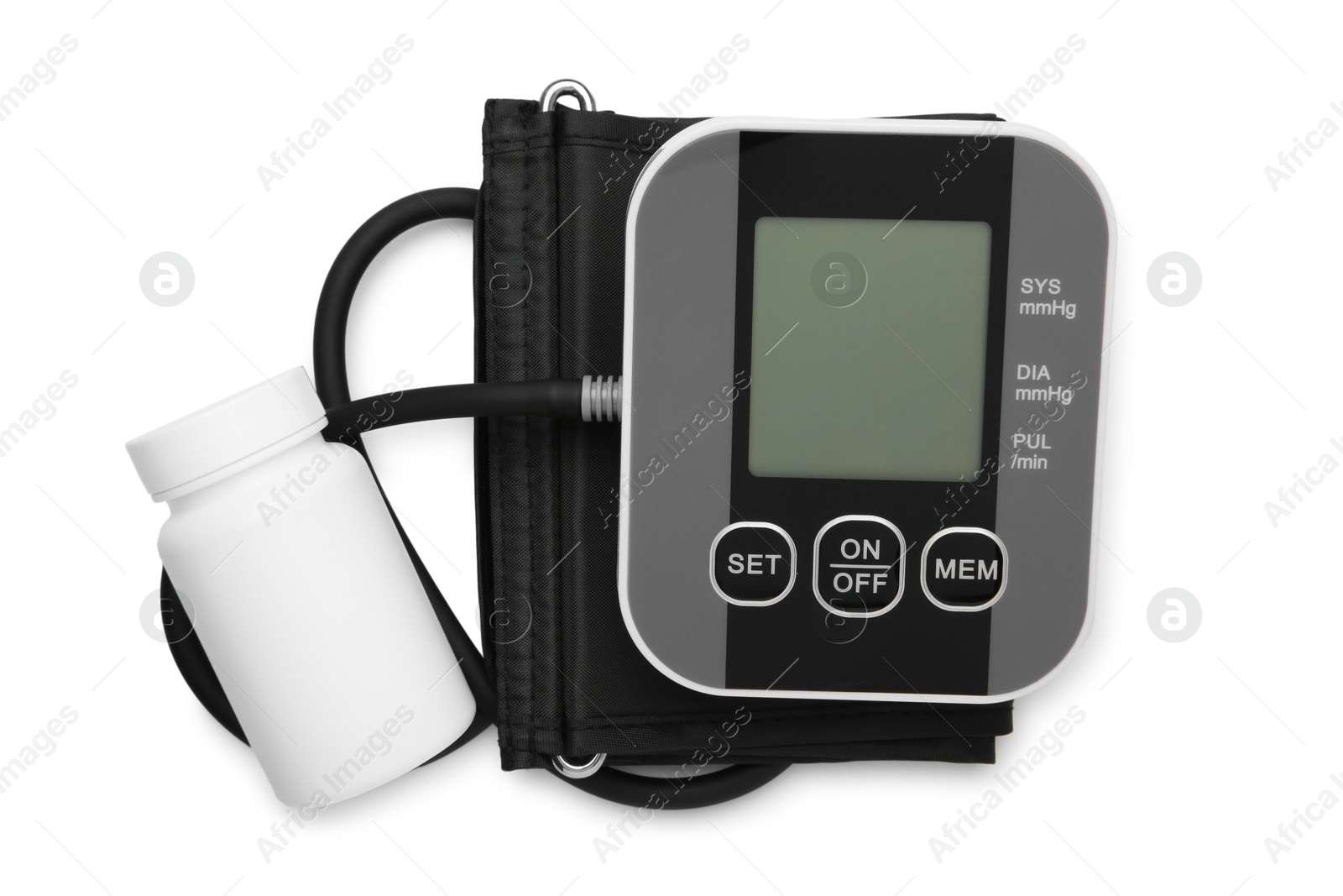 Photo of Blood pressure monitor and jar of pills isolated on white, top view