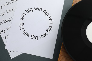 Photo of Flat lay composition with sheets of paper with words Big win on grey table