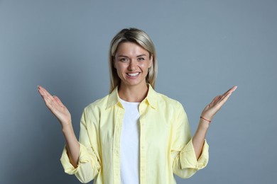 Photo of Portrait of happy winner on gray background