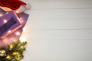 Photo of Flat lay composition with yoga mat and Christmas decor on white wooden background, space for text