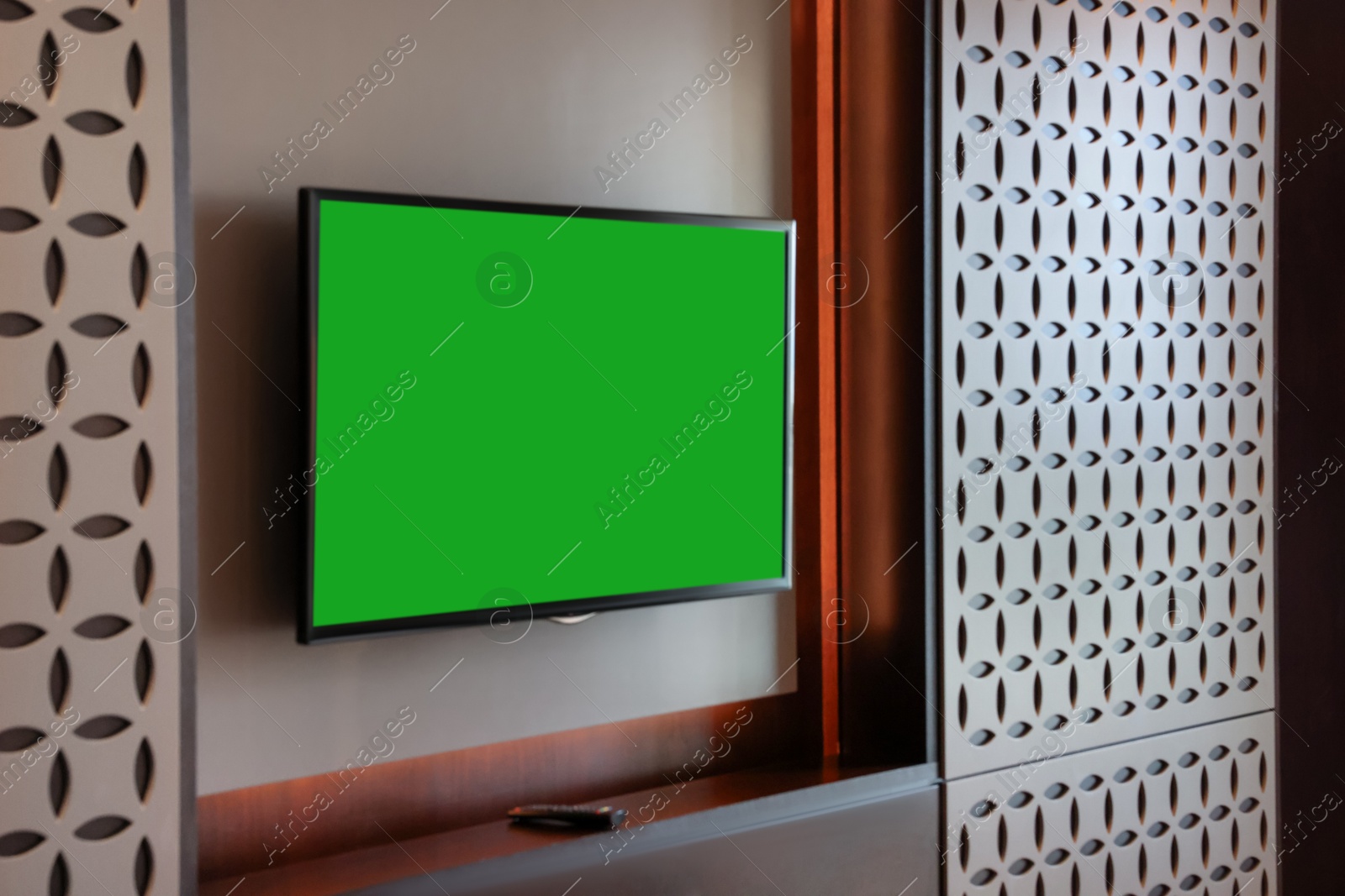 Photo of Tv set mounted on wall in room