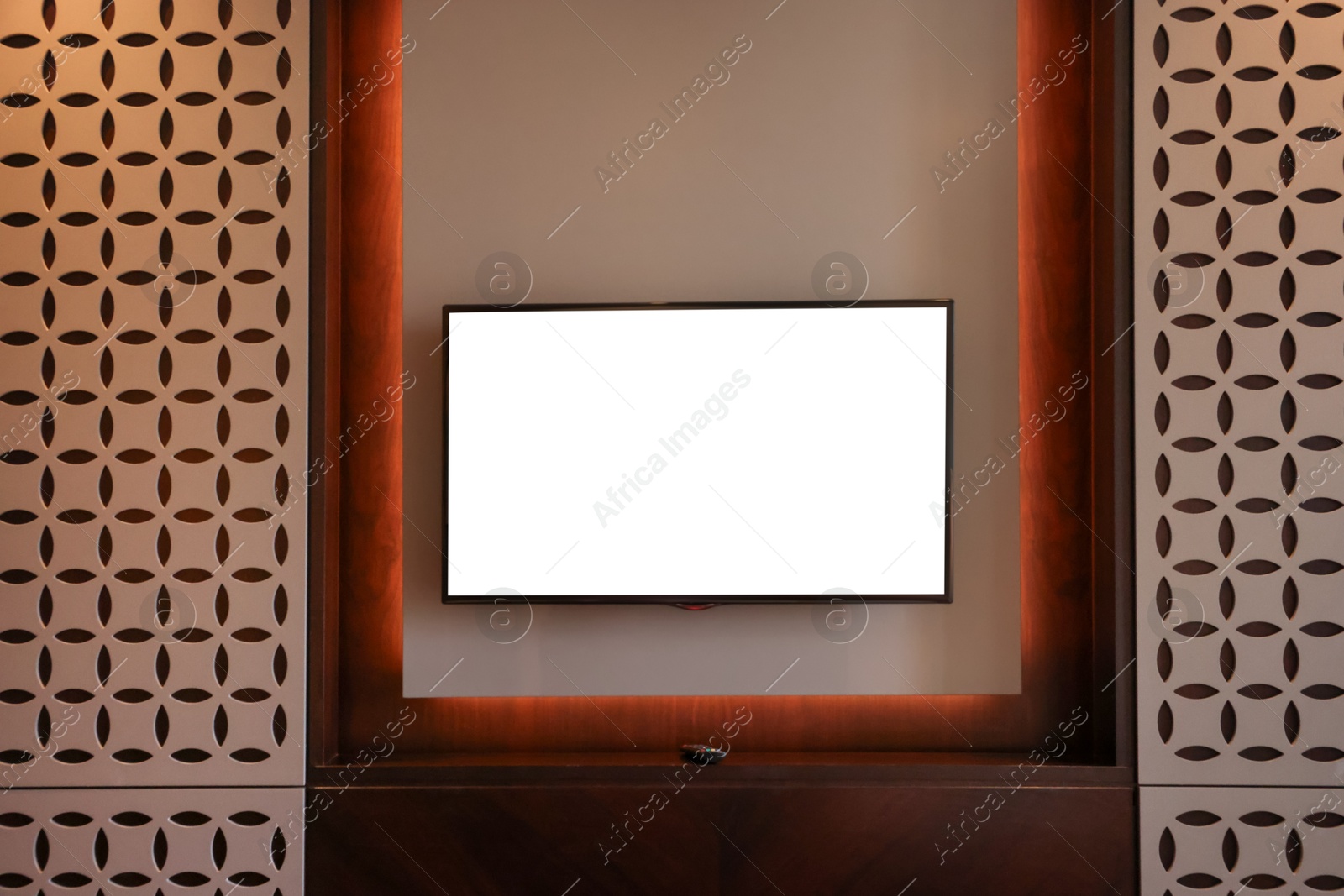 Photo of Tv set mounted on wall in room