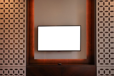 Photo of Tv set mounted on wall in room