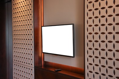 Photo of Tv set mounted on wall in room