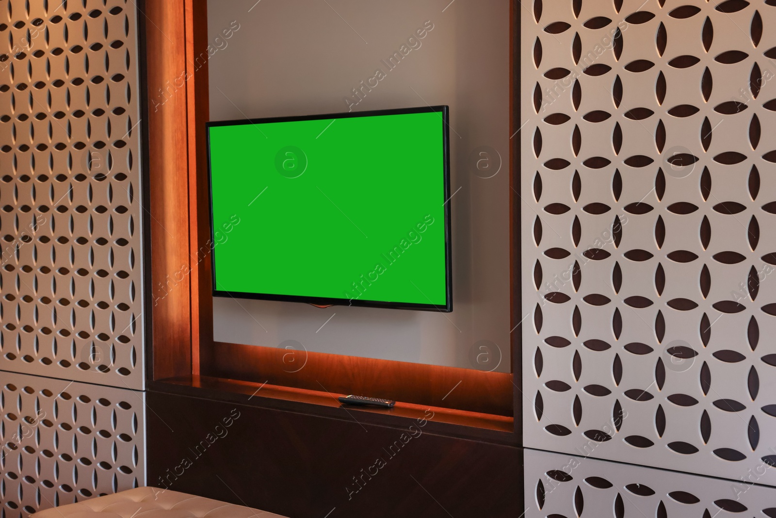 Photo of Tv set mounted on wall in room