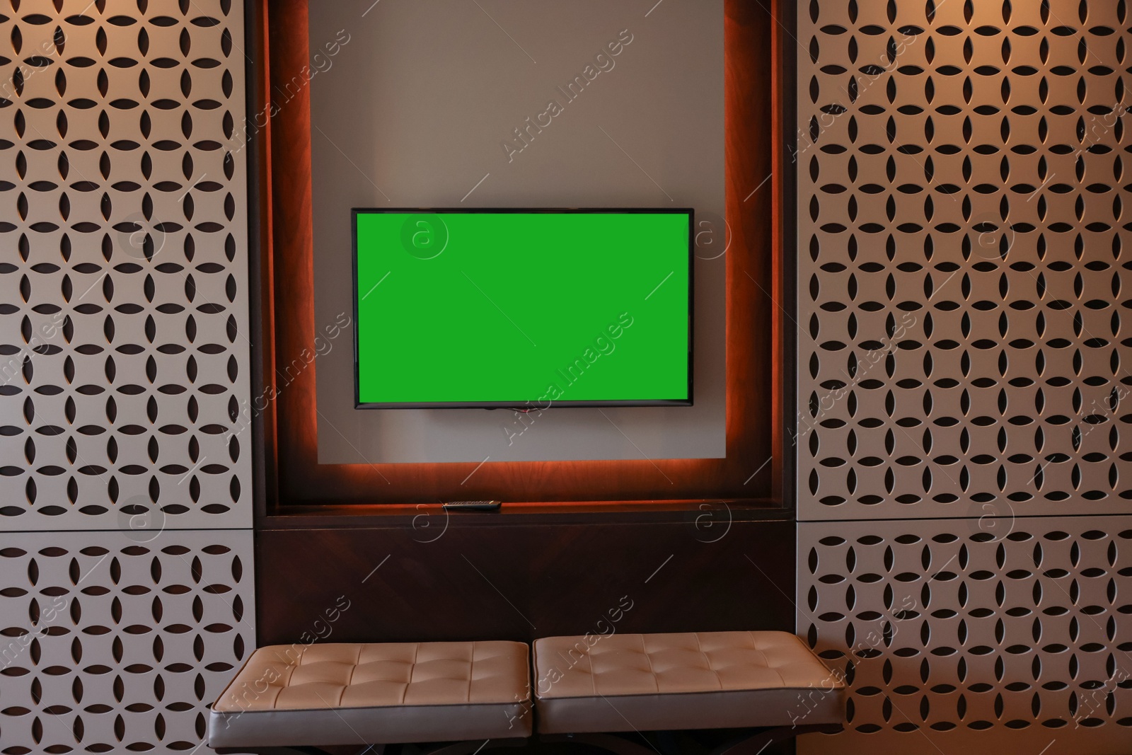 Photo of Tv set mounted on wall in room