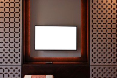 Photo of Tv set mounted on wall in room