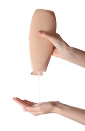 Photo of Woman pouring shampoo onto hand on white background, closeup