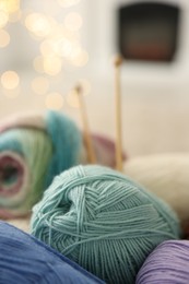 Photo of Many colorful yarns on blurred background, closeup. Space for text