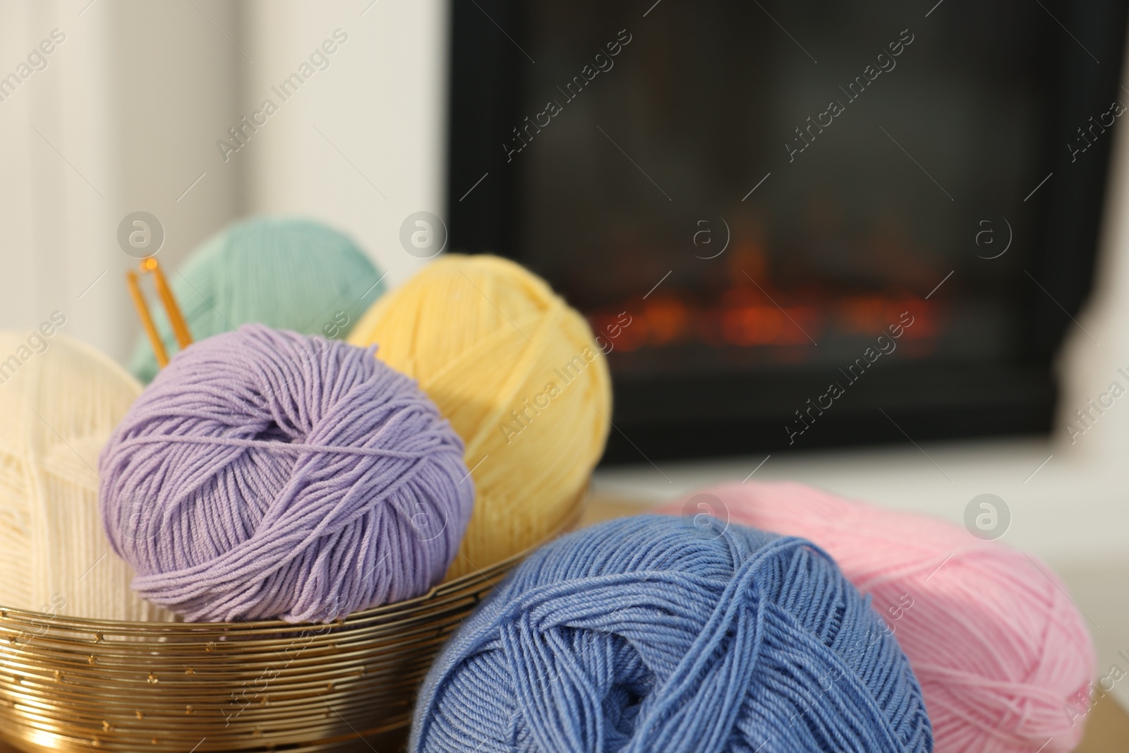 Photo of Many colorful yarns on blurred background, closeup