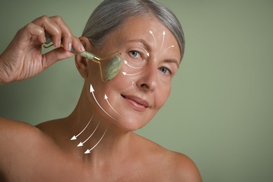 Image of Beautiful woman doing facial massage with roller on sage green background. Arrows on skin showing direction of moves