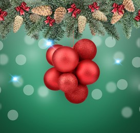 Image of Fir tree branches with festive balls on green background. New Year and Christmas greeting card design