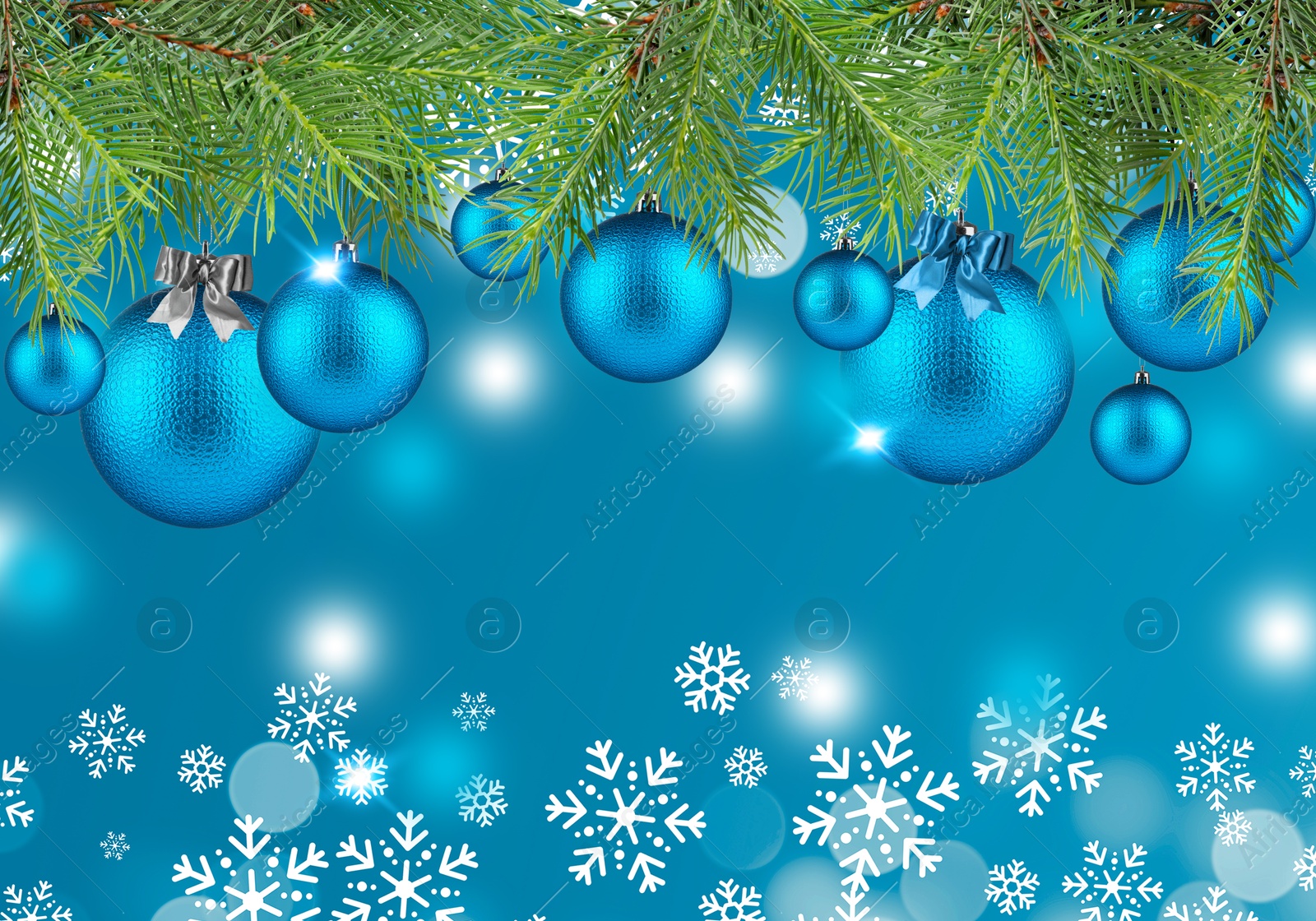 Image of Fir tree branches with festive balls and snowflakes on light blue background. New Year and Christmas greeting card design with space for text