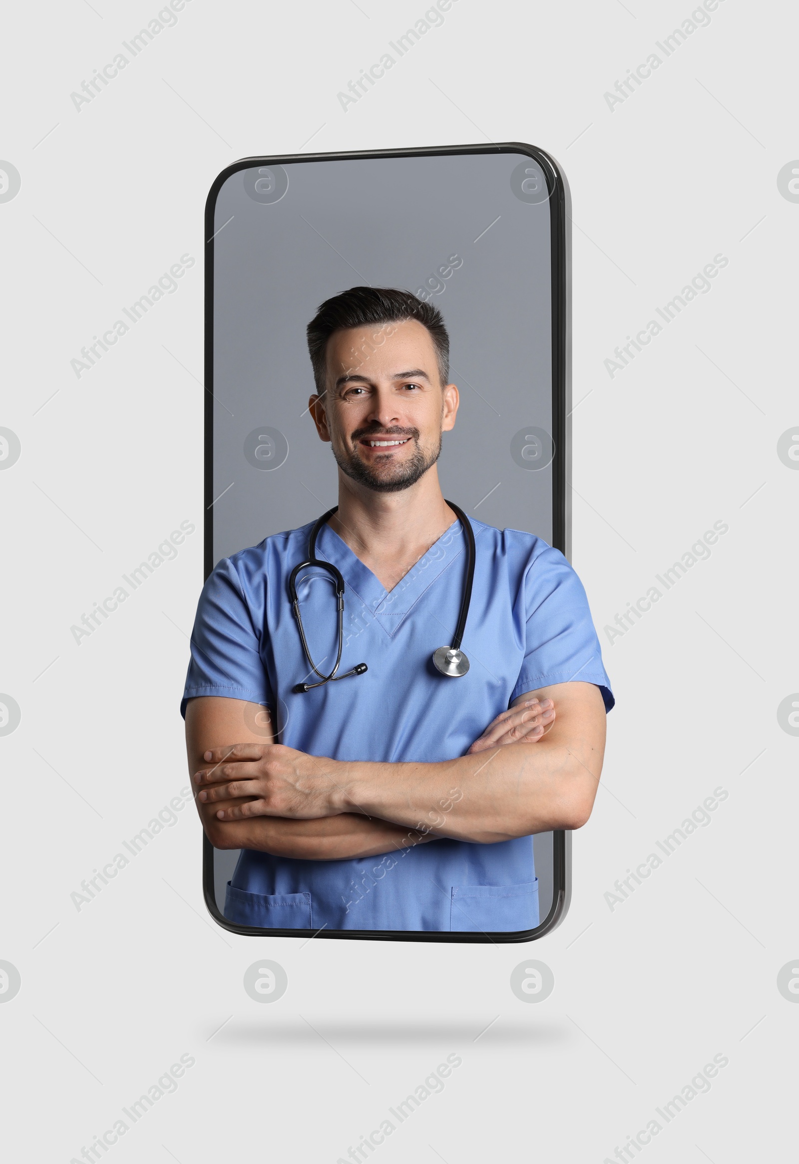 Image of Online doctor standing out of mobile phone screen on light background