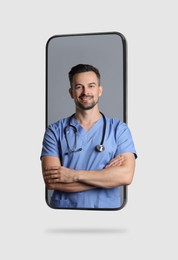 Image of Online doctor standing out of mobile phone screen on light background