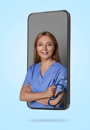 Image of Online doctor standing out of mobile phone screen on light blue background