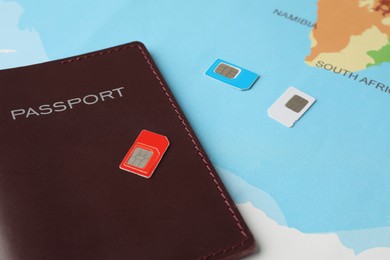 Photo of Passport and SIM cards on world map