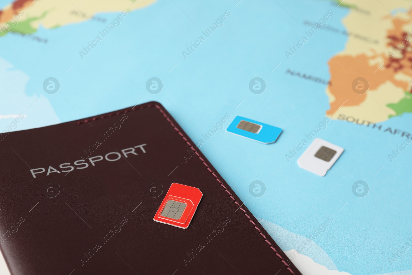 Photo of Passport and SIM cards on world map