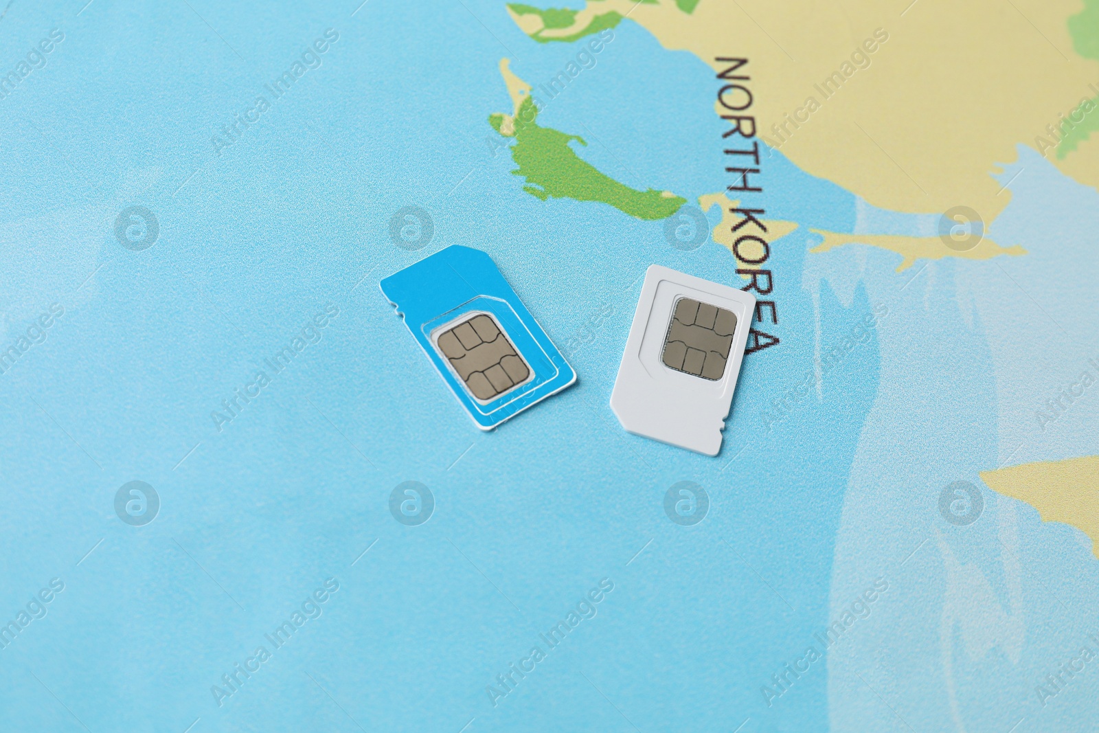 Photo of SIM cards on world map, above view