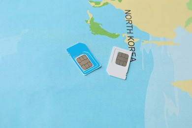 Photo of SIM cards on world map, above view