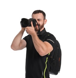 Photographer with backpack and camera taking picture on white background