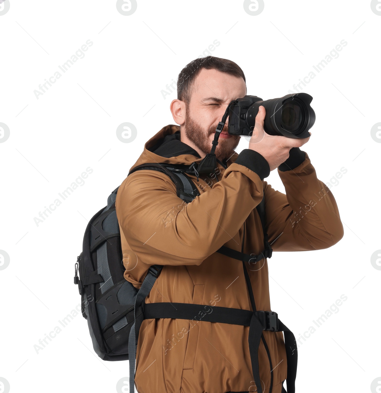 Photo of Photographer with backpack and camera taking picture on white background