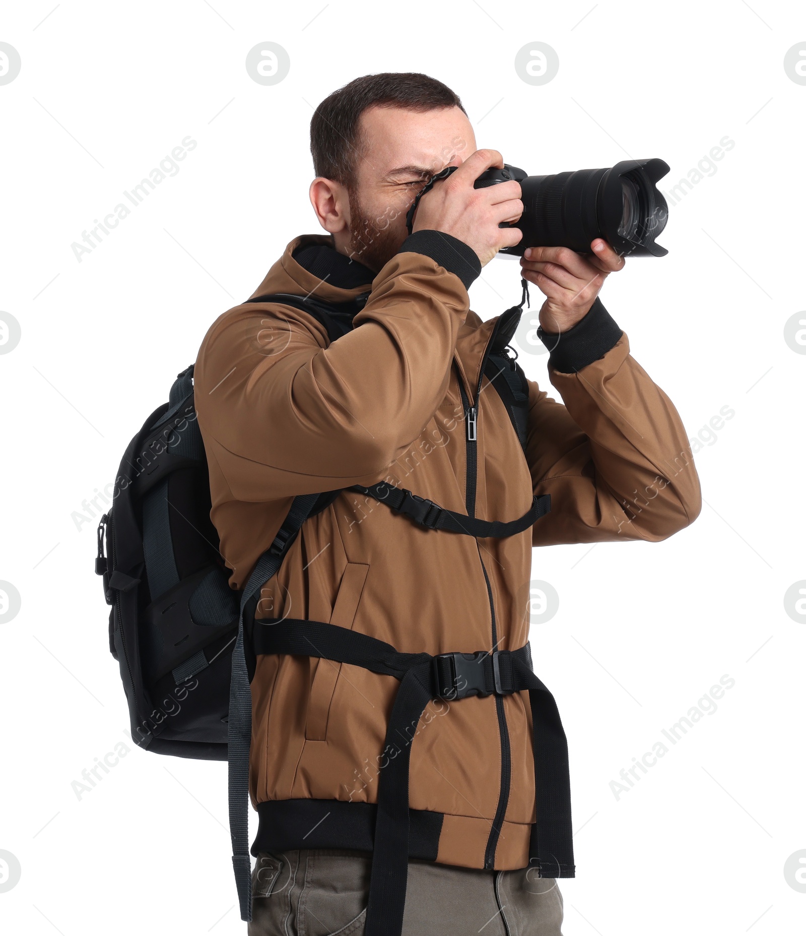 Photo of Photographer with backpack and camera taking picture on white background