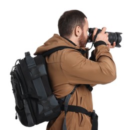 Photographer with backpack and camera taking picture on white background