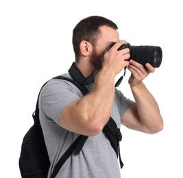 Photographer with backpack and camera taking picture on white background