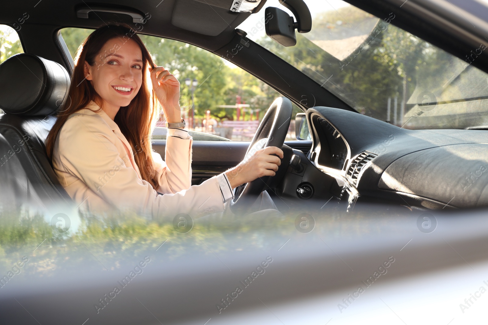 Photo of Woman holding steering wheel while driving car