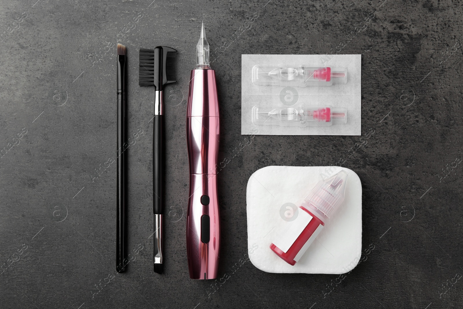 Photo of Professional permanent makeup machine, disposable cartridge systems and different brushes on grey background, flat lay