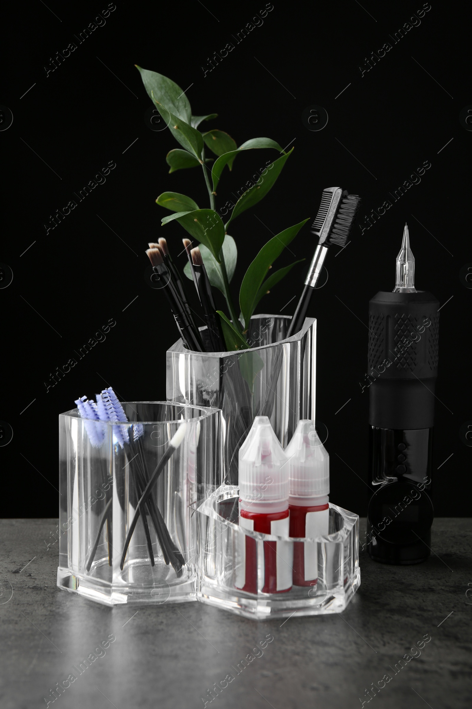 Photo of Permanent makeup equipment kit on grey table