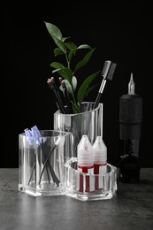 Photo of Permanent makeup equipment kit on grey table