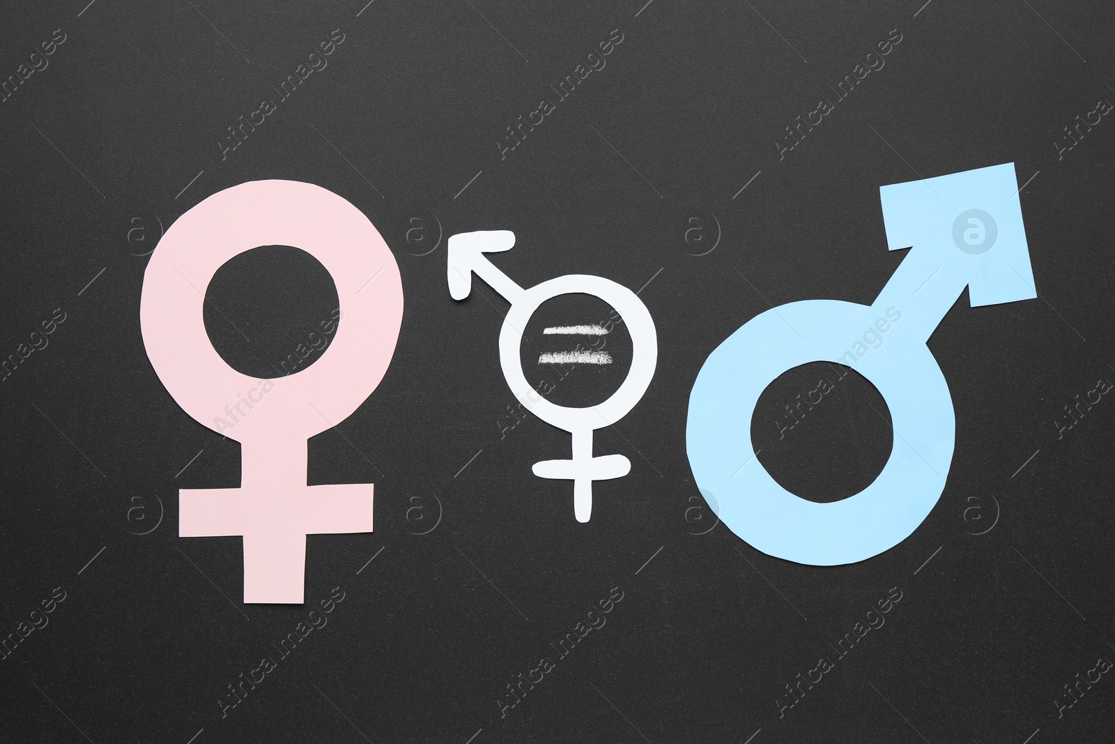 Photo of Equality concept. Male and female gender signs on chalkboard, flat lay