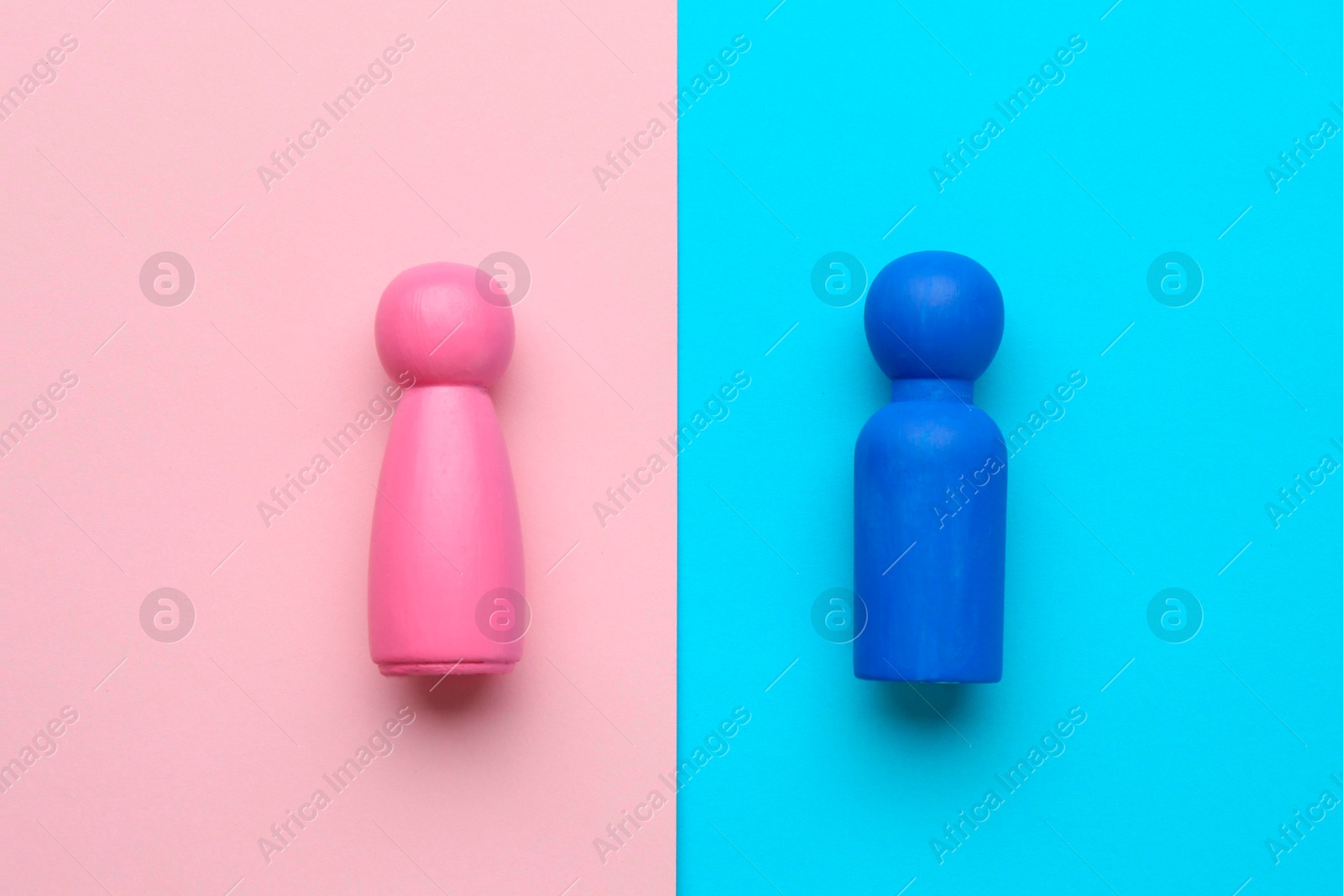 Photo of Gender equality concept. Male and female figures on color background, flat lay